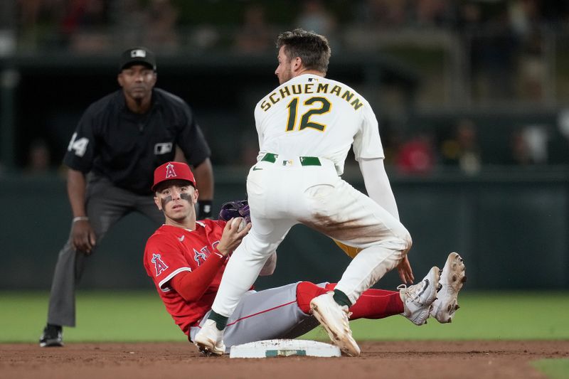 May 21, 2025; West Sacramento, California, USA; Los Angeles Angels shortstop Zach Neto (9) holds onto the ball after forcing Athletics shortstop Max Schuemann (12) out at second base in the fifth inning at Sutter Health Park. Mandatory Credit: Cary Edmondson-Imagn Images
