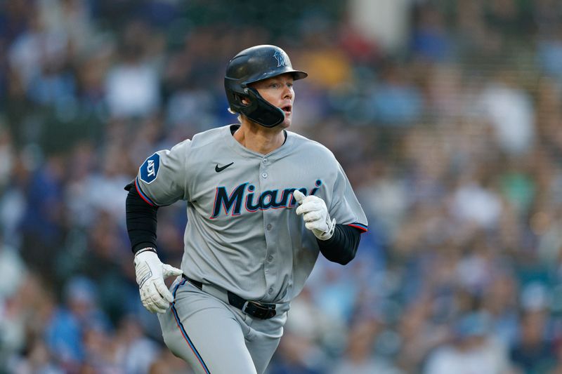 May 13, 2025; Chicago, Illinois, USA; Miami Marlins left fielder Kyle Stowers (28) rounds the bases after hitting a solo home run against the Chicago Cubs during the second inning at Wrigley Field. Mandatory Credit: Kamil Krzaczynski-Imagn Images