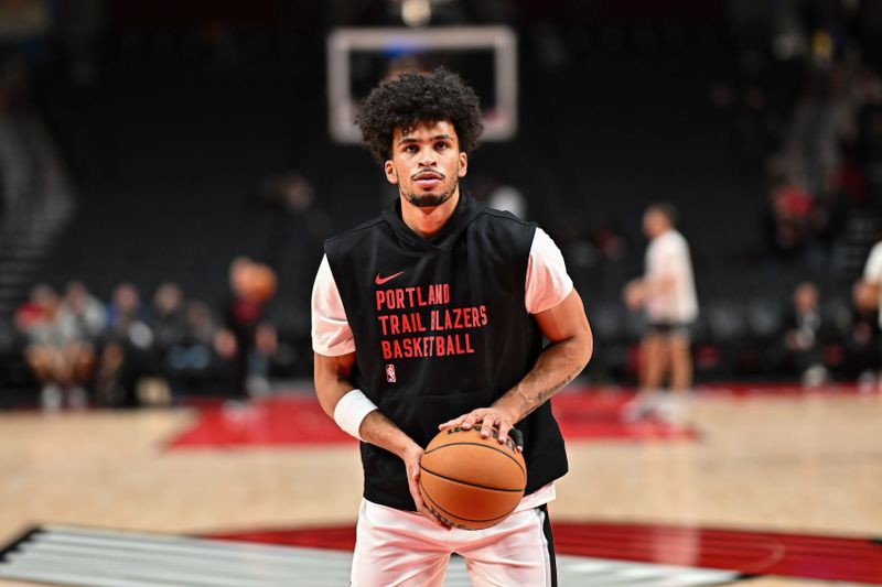 PORTLAND, OREGON - OCTOBER 18: Toumani Camara #33 of the Portland Trail Blazers warms up before the game against the Utah Jazz at Moda Center on October 18, 2024 in Portland, Oregon. NOTE TO USER: User expressly acknowledges and agrees that, by downloading and or using this photograph, User is consenting to the terms and conditions of the Getty Images License Agreement. (Photo by Alika Jenner/Getty Images)