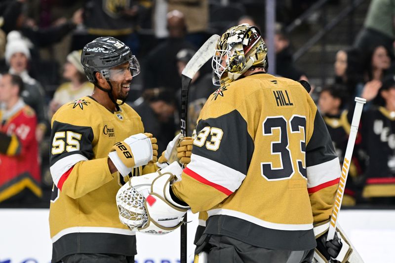 Oct 28, 2024; Las Vegas, Nevada, USA; Vegas Golden Knights right wing Keegan Kolesar (55) and Vegas Golden Knights goaltender Adin Hill (33) celebrate the win over the Calgary Flames at T-Mobile Arena. Mandatory Credit: Candice Ward-Imagn Images