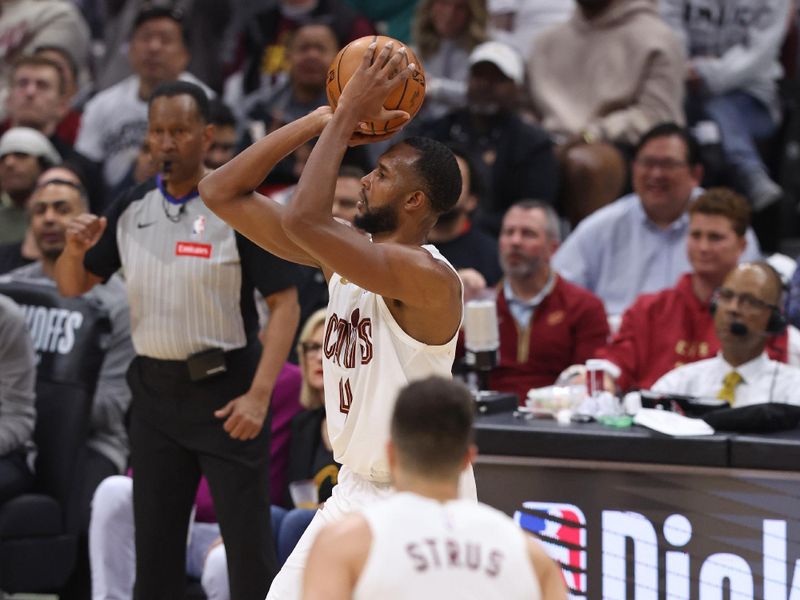 CLEVELAND, OH - APRIL 22: Evan Mobley #4 of the Cleveland Cavaliers shoots a three point basket during the game against the Orlando Magic during Round 1 Game 2 of the 2024 NBA Playoffs on April 22, 2024 at Rocket Mortgage FieldHouse in Cleveland, Ohio. NOTE TO USER: User expressly acknowledges and agrees that, by downloading and/or using this Photograph, user is consenting to the terms and conditions of the Getty Images License Agreement. Mandatory Copyright Notice: Copyright 2024 NBAE (Photo by Lauren Leigh Bacho/NBAE via Getty Images)