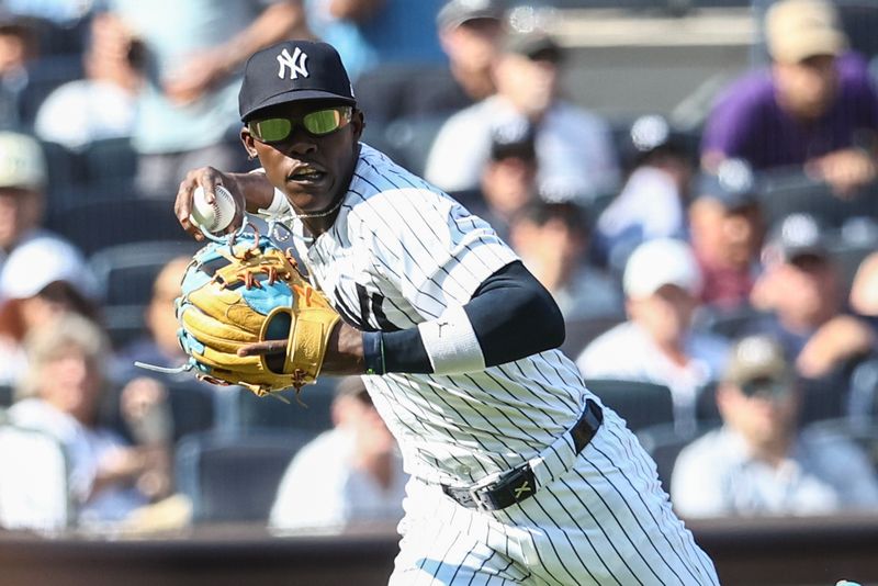 Aug 24, 2024; Bronx, New York, USA;  New York Yankees third baseman Jazz Chisholm Jr. (13) makes a running throw to fist base in the fifth inning against the Colorado Rockies at Yankee Stadium. Mandatory Credit: Wendell Cruz-USA TODAY Sports