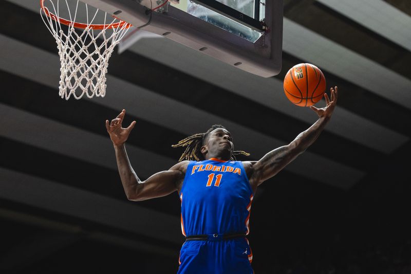 Mar 5, 2025; Tuscaloosa, Alabama, USA; Florida Gators guard Denzel Aberdeen (11) makes an assist against the Alabama Crimson Tide during the first half at Coleman Coliseum. Mandatory Credit: Will McLelland-Imagn Images