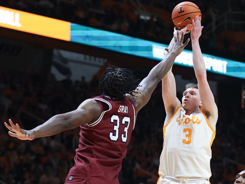 Jan 30, 2024; Knoxville, Tennessee, USA; Tennessee Volunteers guard Dalton Knecht (3) shoots the ball against South Carolina Gamecocks forward Josh Gray (33) during the first half at Thompson-Boling Arena at Food City Center. Mandatory Credit: Randy Sartin-USA TODAY Sports