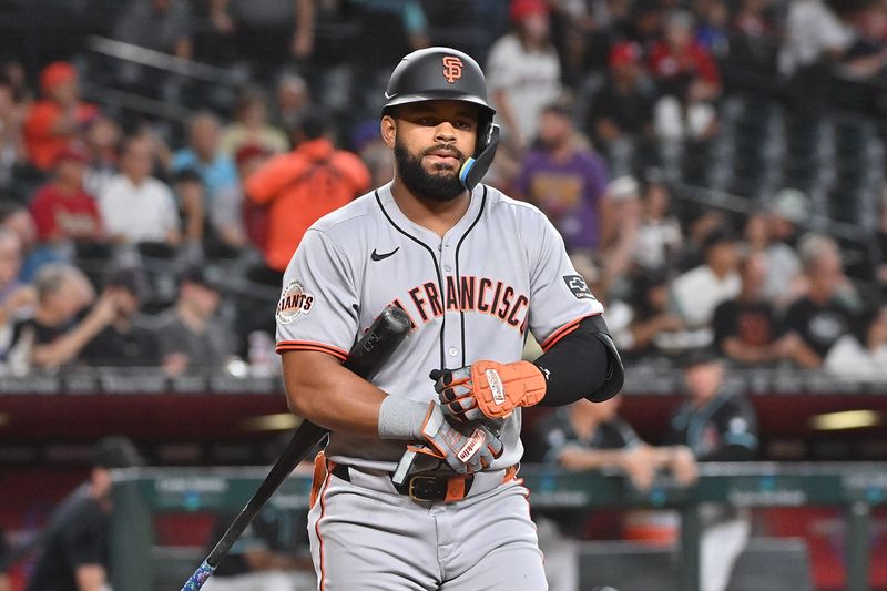 Jun 30, 2025; Phoenix, Arizona, USA;  San Francisco Giants outfielder Heliot Ramos (17) reacts after striking out in the first inning against the Arizona Diamondbacks at Chase Field. Mandatory Credit: Matt Kartozian-Imagn Images