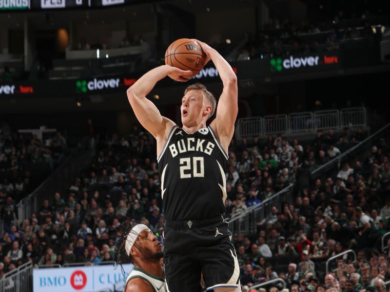 MILWAUKEE, WI - JANUARY 11: AJ Green #20 of the Milwaukee Bucks shoots a three point basket during the game  on January 11, 2024 at the Fiserv Forum Center in Milwaukee, Wisconsin. NOTE TO USER: User expressly acknowledges and agrees that, by downloading and or using this Photograph, user is consenting to the terms and conditions of the Getty Images License Agreement. Mandatory Copyright Notice: Copyright 2024 NBAE (Photo by Gary Dineen/NBAE via Getty Images).