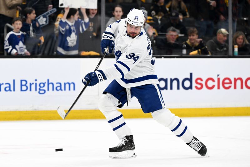 Apr 22, 2024; Boston, Massachusetts, USA; Toronto Maple Leafs center Auston Matthews (34) takes a shot during warmups before a game against the Boston Bruins in game two of the first round of the 2024 Stanley Cup Playoffs at TD Garden. Mandatory Credit: Brian Fluharty-USA TODAY Sports