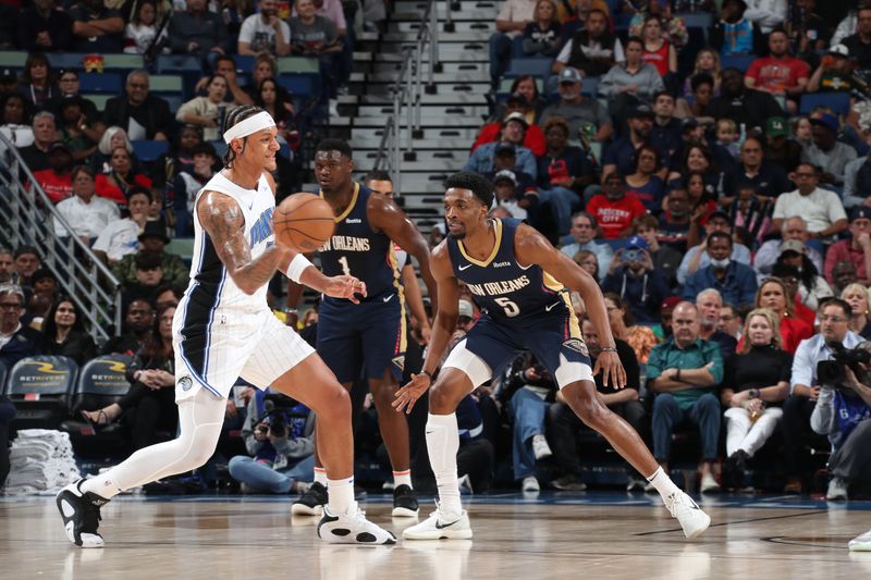 NEW ORLEANS, LA - APRIL 3:  Paolo Banchero #5 of the Orlando Magic passes the ball during the game  against the New Orleans Pelicans on April 3, 2024 at the Smoothie King Center in New Orleans, Louisiana. NOTE TO USER: User expressly acknowledges and agrees that, by downloading and or using this Photograph, user is consenting to the terms and conditions of the Getty Images License Agreement. Mandatory Copyright Notice: Copyright 2024 NBAE (Photo by Layne Murdoch Jr./NBAE via Getty Images)