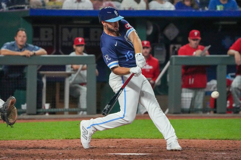 Aug 23, 2024; Kansas City, Missouri, USA; Kansas City Royals third baseman Paul DeJong (15) hits a one run single against the Philadelphia Phillies in the fifth inning at Kauffman Stadium. Mandatory Credit: Denny Medley-USA TODAY Sports