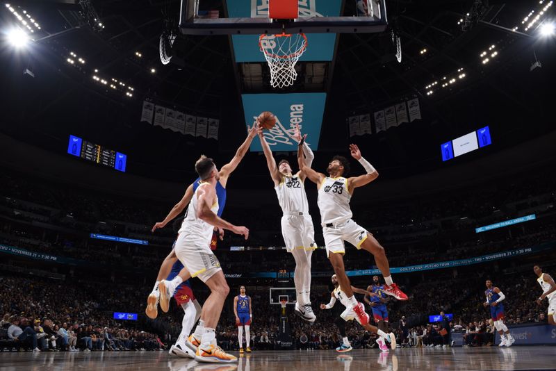 DENVER, CO - NOVEMBER 2: Kyle Filipowski #22 of the Utah Jazz goes up for the rebound during the game against the Denver Nuggets on November 2, 2024 at Ball Arena in Denver, Colorado. NOTE TO USER: User expressly acknowledges and agrees that, by downloading and/or using this Photograph, user is consenting to the terms and conditions of the Getty Images License Agreement. Mandatory Copyright Notice: Copyright 2024 NBAE (Photo by Garrett Ellwood/NBAE via Getty Images)