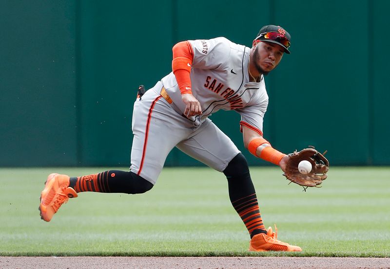 May 23, 2024; Pittsburgh, Pennsylvania, USA; San Francisco Giants second baseman Thairo Estrada (39) fields a ground ball for an out against Pittsburgh Pirates left fielder Bryan Reynolds (not pictured) during the first inning at PNC Park. Mandatory Credit: Charles LeClaire-USA TODAY Sports