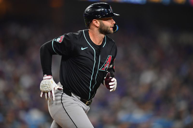 May 22, 2024; Los Angeles, California, USA; Arizona Diamondbacks first baseman Christian Walker (53) runs the bases after hitting a solo home run against the Los Angeles Dodgers during the sixth inning at Dodger Stadium. Mandatory Credit: Gary A. Vasquez-USA TODAY Sports