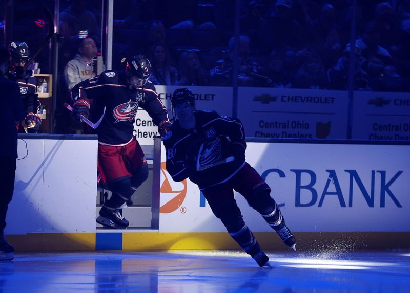 Dec 11, 2025; Columbus, Ohio, USA;  Columbus Blue Jackets defenseman Damon Severson (78) and left wing Miles Wood (11) take the ice before the game against the Ottawa Senators at Nationwide Arena. Mandatory Credit: Joseph Maiorana-Imagn Images