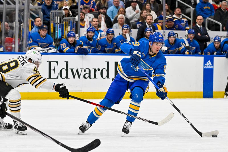 Jan 13, 2024; St. Louis, Missouri, USA;  St. Louis Blues left wing Pavel Buchnevich (89) controls the puck as Boston Bruins defenseman Matt Grzelcyk (48) defends during the second period at Enterprise Center. Mandatory Credit: Jeff Curry-USA TODAY Sports