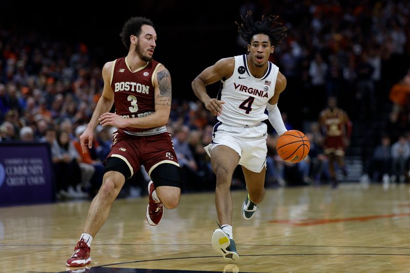 Jan 28, 2023; Charlottesville, Virginia, USA; Virginia Cavaliers guard Armaan Franklin (4) drives to the basket as Boston College Eagles guard Jaeden Zackery (3) defends in the second half at John Paul Jones Arena. Mandatory Credit: Geoff Burke-USA TODAY Sports