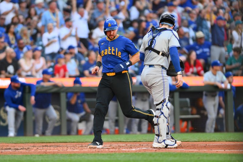 Jul 5, 2024; Seattle, Washington, USA; Seattle Mariners catcher Cal Raleigh (29) scores a run against the Toronto Blue Jays during the third inning at T-Mobile Park. Mandatory Credit: Steven Bisig-USA TODAY Sports