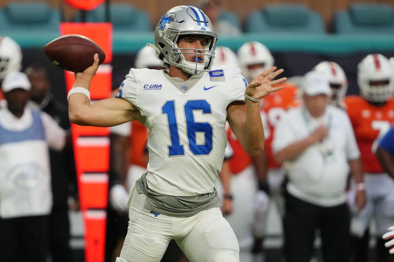 Sep 24, 2022; Miami Gardens, Florida, USA; Middle Tennessee Blue Raiders quarterback Chase Cunningham (16) attempts a pass against the Miami Hurricanes during the first half at Hard Rock Stadium. Mandatory Credit: Jasen Vinlove-USA TODAY Sports