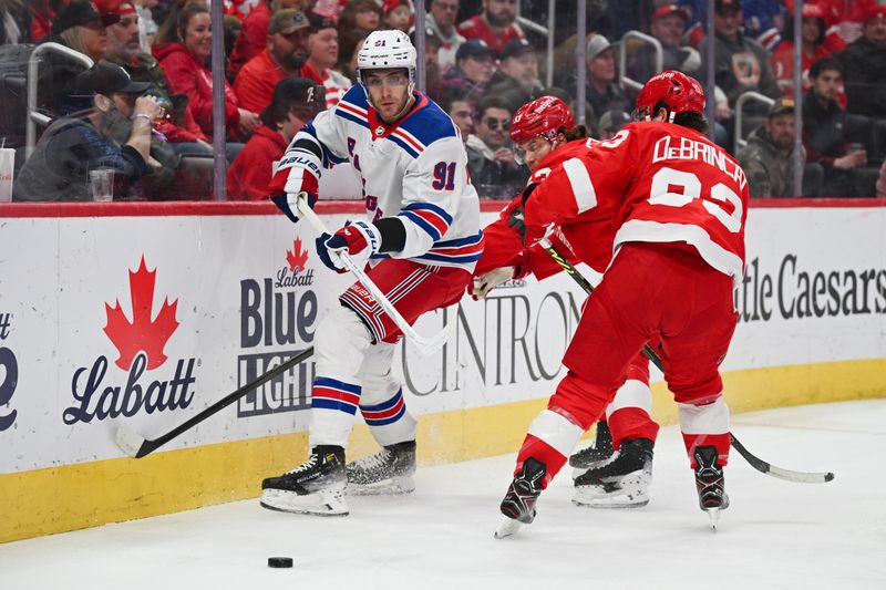 Apr 5, 2024; Detroit, Michigan, USA; New York Rangers center Alex Wennberg (91) clears the puck around Detroit Red Wings right wing Alex DeBrincat (93) during the first period at Little Caesars Arena. Mandatory Credit: Tim Fuller-USA TODAY Sports