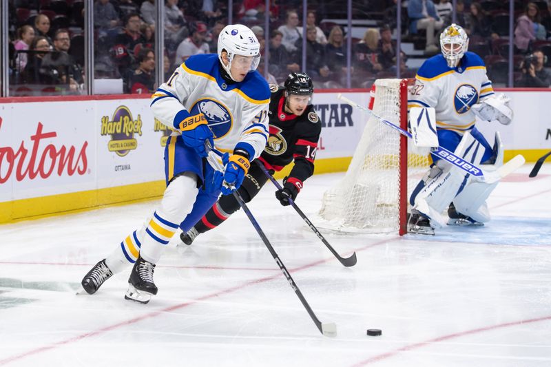 Sep 26, 2024; Ottawa, Ontario, CAN; Buffalo Sabres defenseman Nikita Novikov (91) skates with the puck in front of Ottawa Senators center Jan Jenik (14) in the first period at the Canadian Tire Centre. Mandatory Credit: Marc DesRosiers-Imagn Images