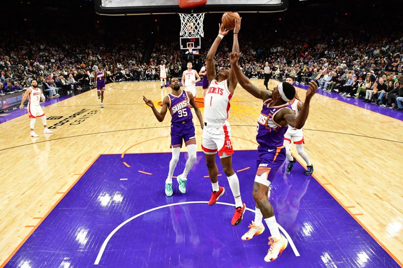 PHOENIX, AZ - MARCH 2:  Amen Thompson #1 of the Houston Rockets drives to the basket during the game against the Phoenix Suns on March 2, 2024 at Footprint Center in Phoenix, Arizona. NOTE TO USER: User expressly acknowledges and agrees that, by downloading and or using this photograph, user is consenting to the terms and conditions of the Getty Images License Agreement. Mandatory Copyright Notice: Copyright 2023 NBAE (Photo by Kate Frese/NBAE via Getty Images)