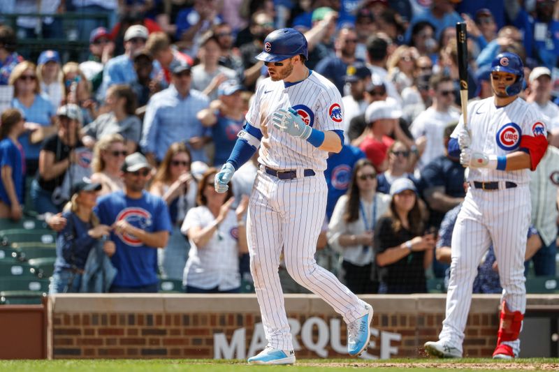 May 5, 2023; Chicago, Illinois, USA; Chicago Cubs left fielder Ian Happ (8) crosses home plate after hitting a two-run home run against the Miami Marlins during the fifth inning at Wrigley Field. Mandatory Credit: Kamil Krzaczynski-USA TODAY Sports