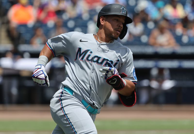 Jun 8, 2025; St. Petersburg, Florida, USA;  Miami Marlins outfielder Heriberto Hernandez (64) singles during the second inning against the Tampa Bay Rays at George M. Steinbrenner Field. Mandatory Credit: Kim Klement Neitzel-Imagn Images