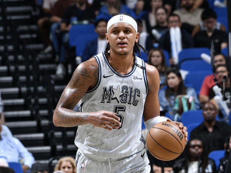 ORLANDO, FL - FEBRUARY 10: Paolo Banchero #5 of the Orlando Magic brings the ball up court during the game against the Atlanta Hawks on February 10, 2025 at Kia Center in Orlando, Florida. NOTE TO USER: User expressly acknowledges and agrees that, by downloading and or using this photograph, User is consenting to the terms and conditions of the Getty Images License Agreement. Mandatory Copyright Notice: Copyright 2025 NBAE (Photo by Fernando Medina/NBAE via Getty Images)