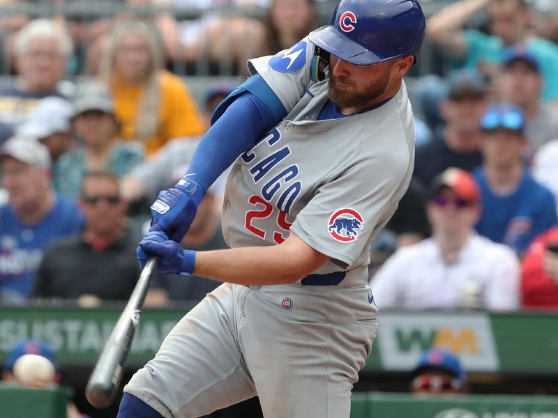 May 1, 2025; Pittsburgh, Pennsylvania, USA;  Chicago Cubs first baseman Michael Busch (29) hits a two run single against the Pittsburgh Pirates during the ninth inning at PNC Park. Mandatory Credit: Charles LeClaire-Imagn Images