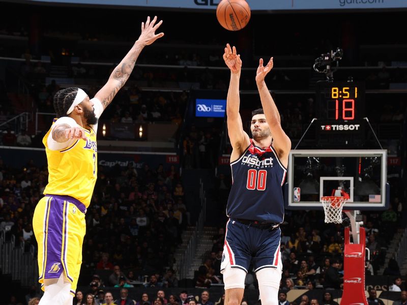 WASHINGTON, DC -? APRIL 3: Tristan Vukcevic #00 of the Washington Wizards shoots a three point basket over Anthony Davis #3 of the Los Angeles Lakers during the game on April 3, 2024 at Capital One Arena in Washington, DC. NOTE TO USER: User expressly acknowledges and agrees that, by downloading and or using this Photograph, user is consenting to the terms and conditions of the Getty Images License Agreement. Mandatory Copyright Notice: Copyright 2024 NBAE (Photo by Stephen Gosling/NBAE via Getty Images)