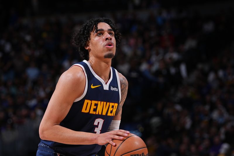 DENVER, CO - MARCH 25: Julian Strawther #3 of the Denver Nuggets shoots a free throw during the game against the Memphis Grizzlies on March 25, 2024 at the Ball Arena in Denver, Colorado. NOTE TO USER: User expressly acknowledges and agrees that, by downloading and/or using this Photograph, user is consenting to the terms and conditions of the Getty Images License Agreement. Mandatory Copyright Notice: Copyright 2024 NBAE (Photo by Bart Young/NBAE via Getty Images)