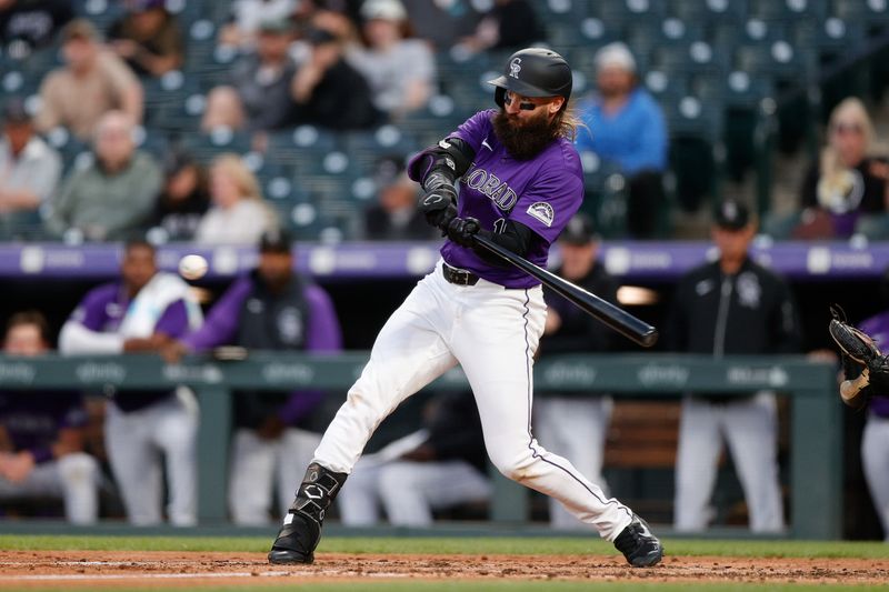 Apr 22, 2024; Denver, Colorado, USA; Colorado Rockies designated hitter Charlie Blackmon (19) hits a double in the fourth inning against the San Diego Padres at Coors Field. Mandatory Credit: Isaiah J. Downing-USA TODAY Sports