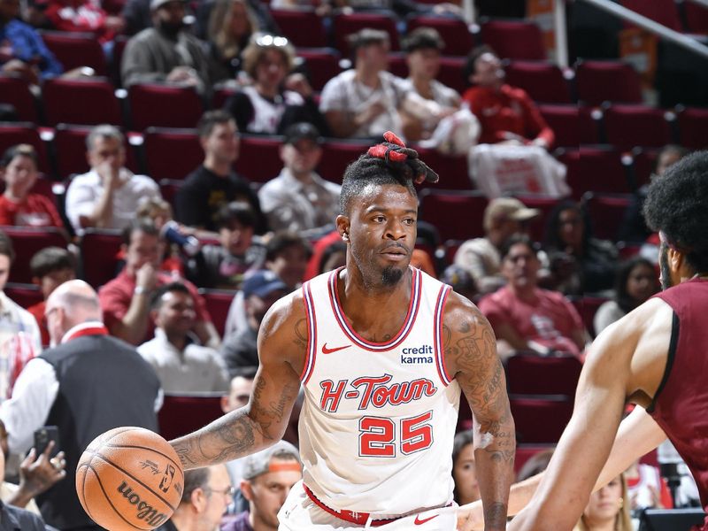 HOUSTON, TX - MARCH 16:  Reggie Bullock Jr. #25 of the Houston Rockets dribbles the ball during the game against the Cleveland Cavaliers on March 16, 2023 at the Toyota Center in Houston, Texas. NOTE TO USER: User expressly acknowledges and agrees that, by downloading and or using this photograph, User is consenting to the terms and conditions of the Getty Images License Agreement. Mandatory Copyright Notice: Copyright 2024 NBAE (Photo by Logan Riely/NBAE via Getty Images)