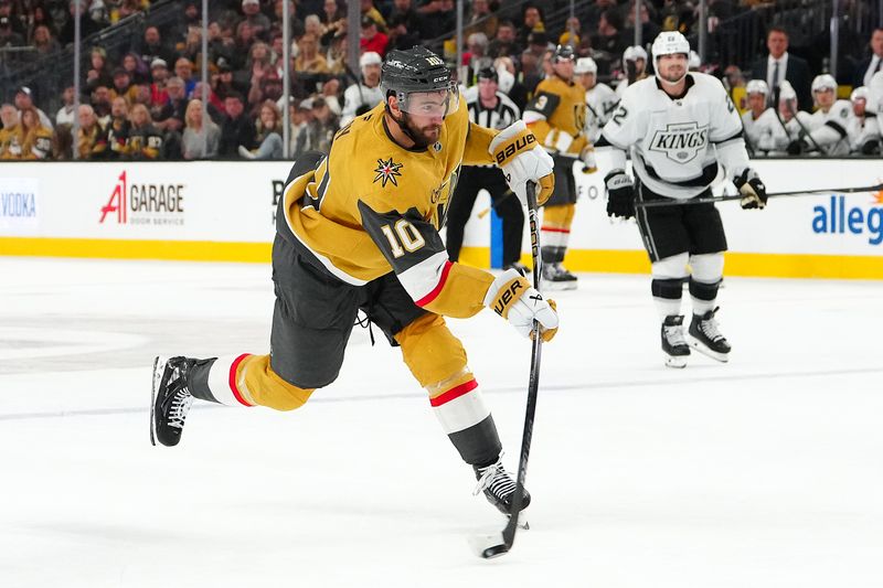 Oct 22, 2024; Las Vegas, Nevada, USA; Vegas Golden Knights center Nicolas Roy (10) shoots against the Los Angeles Kings during the second period at T-Mobile Arena. Mandatory Credit: Stephen R. Sylvanie-Imagn Images