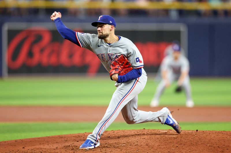 Apr 3, 2024; St. Petersburg, Florida, USA;  Texas Rangers starting pitcher Nathan Eovaldi (17) throws a pitch against the Tampa Bay Rays in the third inning at Tropicana Field. Mandatory Credit: Nathan Ray Seebeck-USA TODAY Sports