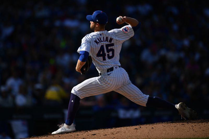 Sep 29, 2024; Chicago, Illinois, USA; Chicago Cubs starting pitcher Caleb Kilian (45) pitches during the fifth inning against the Cincinnati Reds at Wrigley Field. Mandatory Credit: Patrick Gorski-Imagn Images