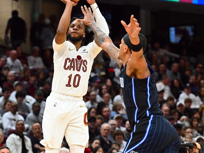 CLEVELAND, OHIO - APRIL 20: Darius Garland #10 of the Cleveland Cavaliers shoots over Paolo Banchero #5 of the Orlando Magic during the fourth quarter of game one of the Eastern Conference First Round Playoffs at Rocket Mortgage Fieldhouse on April 20, 2024 in Cleveland, Ohio. The Cavaliers defeated the Magic 97-83. NOTE TO USER: User expressly acknowledges and agrees that, by downloading and or using this photograph, User is consenting to the terms and conditions of the Getty Images License Agreement. (Photo by Jason Miller/Getty Images)