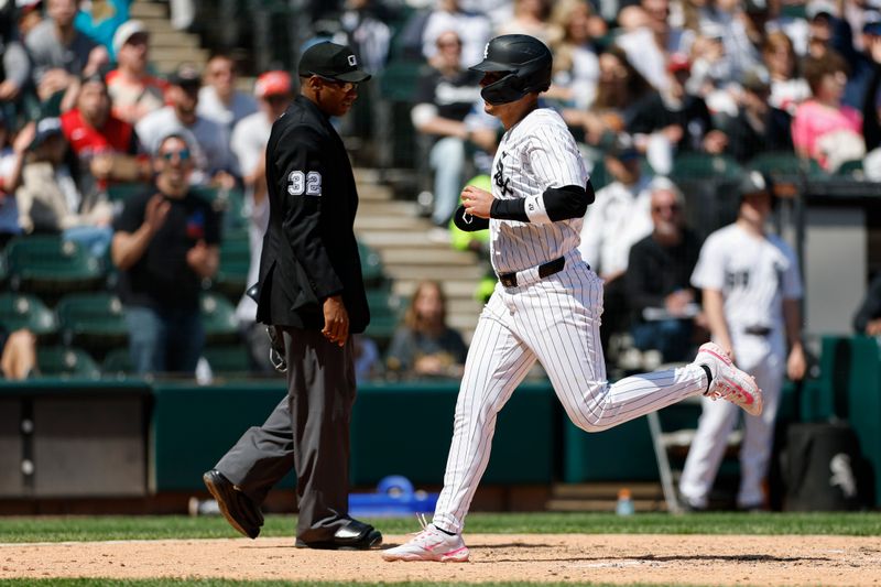 May 25, 2025; Chicago, Illinois, USA; Chicago White Sox third baseman Miguel Vargas (20) scores against the Texas Rangers during the sixth inning at Rate Field. Mandatory Credit: Kamil Krzaczynski-Imagn Images