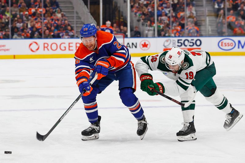 Nov 21, 2024; Edmonton, Alberta, CAN; Edmonton Oilers forward Connor Brown (28) dumps the puck in past Minnesota Wild forward Devin Shore during the first period at Rogers Place. Mandatory Credit: Perry Nelson-Imagn Images