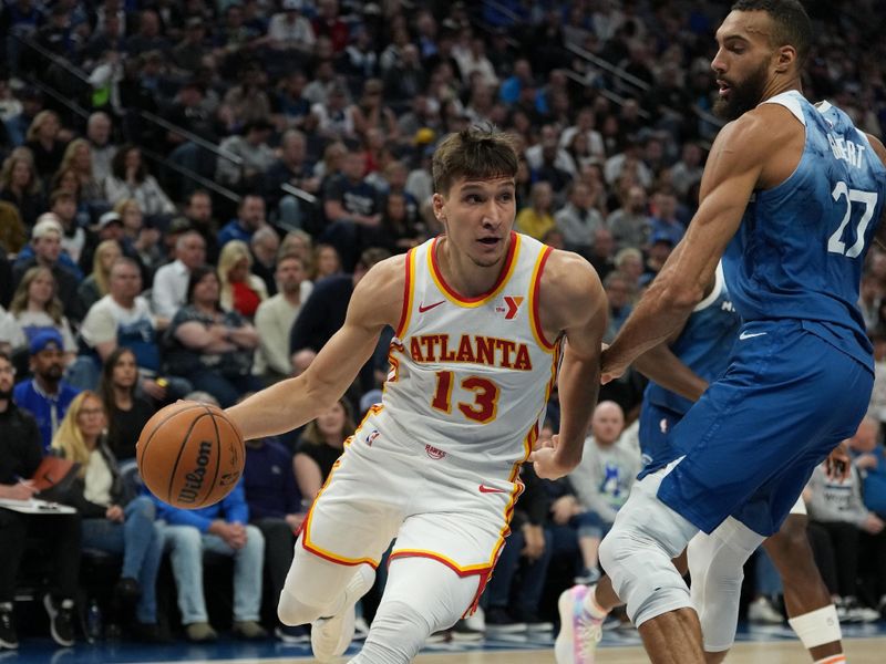 MINNEAPOLIS, MN -  APRIL 12: Bogdan Bogdanovic #13 of the Atlanta Hawks handles the ball during the game against the Minnesota Timberwolves on April 12, 2024 at Target Center in Minneapolis, Minnesota. NOTE TO USER: User expressly acknowledges and agrees that, by downloading and or using this Photograph, user is consenting to the terms and conditions of the Getty Images License Agreement. Mandatory Copyright Notice: Copyright 2024 NBAE (Photo by Jordan Johnson/NBAE via Getty Images)