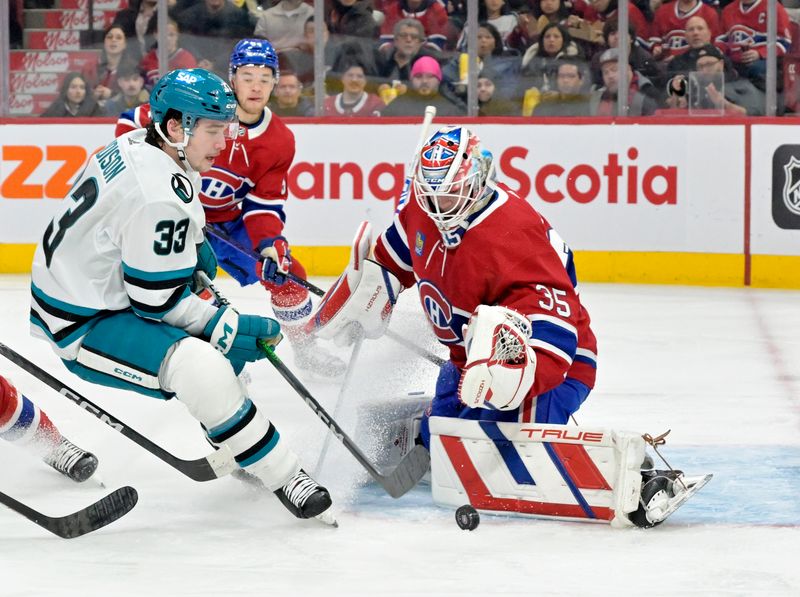 Jan 11, 2024; Montreal, Quebec, CAN; Montreal Canadiens goalie Sam Montembeault (35) stops San Jose Sharks defenseman Calen Addison (33) during the second period at the Bell Centre. Mandatory Credit: Eric Bolte-USA TODAY Sports