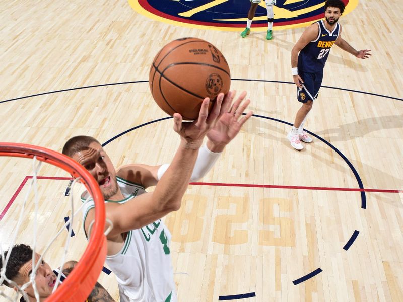 DENVER, CO - JANUARY 7: Kristaps Porzingis #8 of the Boston Celtics drives to the basket during the game against the Denver Nuggets on January 7, 2025 at Ball Arena in Denver, Colorado. NOTE TO USER: User expressly acknowledges and agrees that, by downloading and/or using this Photograph, user is consenting to the terms and conditions of the Getty Images License Agreement. Mandatory Copyright Notice: Copyright 2025 NBAE (Photo by Garrett Ellwood/NBAE via Getty Images)