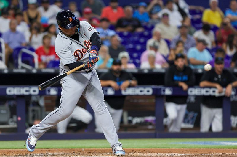 Jul 30, 2023; Miami, Florida, USA; Detroit Tigers designated hitter Miguel Cabrera (24) hits a two-run double against the Miami Marlins during the third inning at loanDepot Park. Mandatory Credit: Sam Navarro-USA TODAY Sports