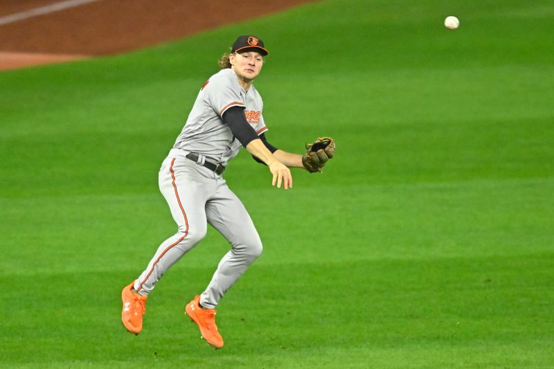 Sep 21, 2023; Cleveland, Ohio, USA; Baltimore Orioles shortstop Gunnar Henderson (2) throws to first base in the seventh inning against the Cleveland Guardians at Progressive Field. Mandatory Credit: David Richard-USA TODAY Sports