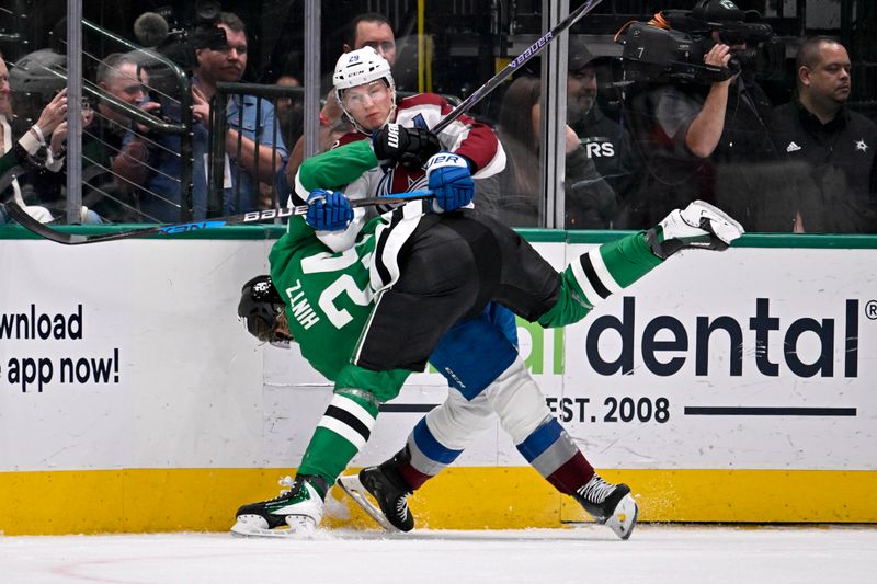 Mar 6, 2026; Dallas, Texas, USA; Dallas Stars center Roope Hintz (24) appears to suffer a lower body injury as he is engages with Colorado Avalanche center Nathan MacKinnon (29) along the boards during the second period at the American Airlines Center. Mandatory Credit: Jerome Miron-Imagn Images