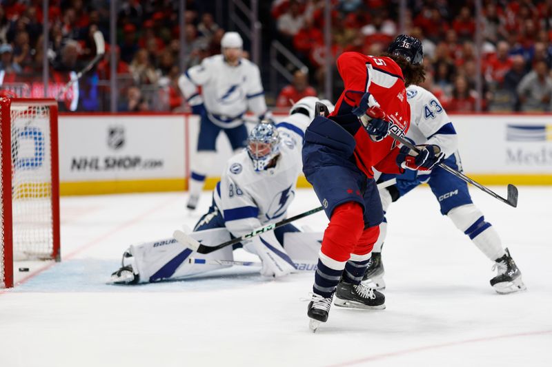 Apr 13, 2024; Washington, District of Columbia, USA; Washington Capitals left wing Sonny Milano (15) scores a goal on Tampa Bay Lightning goaltender Andrei Vasilevskiy (88) in the first period at Capital One Arena. Mandatory Credit: Geoff Burke-USA TODAY Sports