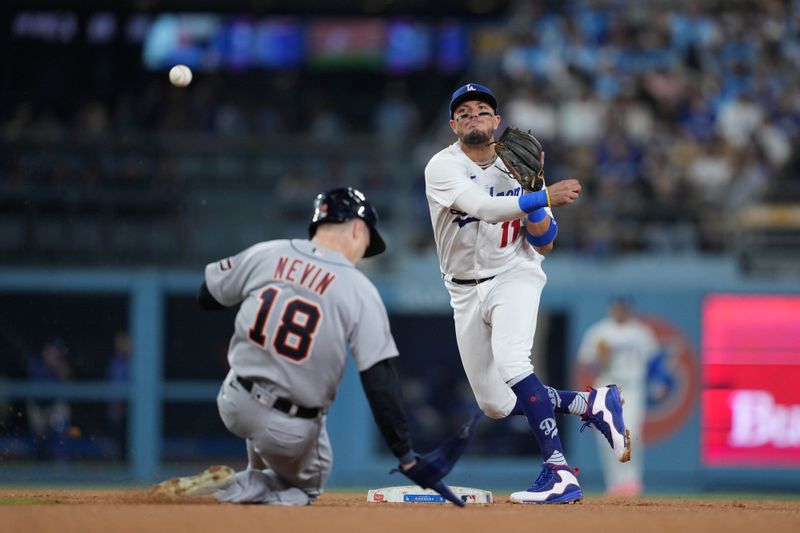 Sep 20, 2023; Los Angeles, California, USA; Los Angeles Dodgers shortstop Miguel Rojas (11) forces out Detroit Tigers second baseman Tyler Nevin (18) out at second base in the seventh inning at Dodger Stadium. Mandatory Credit: Kirby Lee-USA TODAY Sports