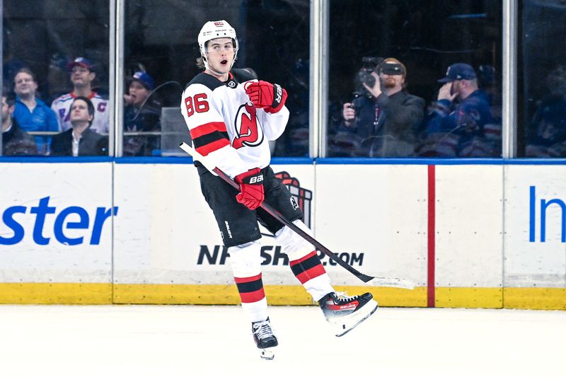 Dec 2, 2024; New York, New York, USA;  New Jersey Devils center Jack Hughes (86) celebrates his goal against the New York Rangers during the second period at Madison Square Garden. Mandatory Credit: Dennis Schneidler-Imagn Images