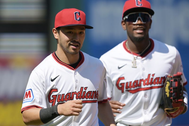 Apr 23, 2025; Cleveland, Ohio, USA; Cleveland Guardians left fielder Steven Kwan (38) and center fielder Angel Martinez (1) run off the field during the sixth inning against the New York Yankees at Progressive Field. Mandatory Credit: Ken Blaze-Imagn Images