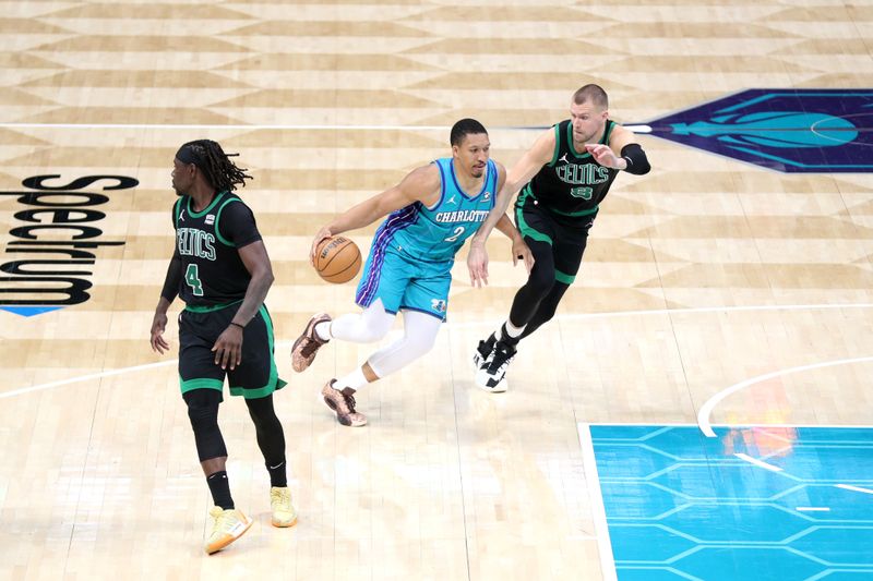 CHARLOTTE, NC - APRIL 1: Grant Williams #2 of the Charlotte Hornets handles the ball during the game against the Boston Celtics on April 1, 2024 at Spectrum Center in Charlotte, North Carolina. NOTE TO USER: User expressly acknowledges and agrees that, by downloading and or using this photograph, User is consenting to the terms and conditions of the Getty Images License Agreement.  Mandatory Copyright Notice:  Copyright 2024 NBAE (Photo by Brock Williams-Smith/NBAE via Getty Images)