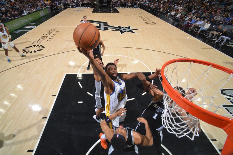 SAN ANTONIO, TX - MARCH 11: Andrew Wiggins #22 of the Golden State Warriors drives to the basket during the game against the San Antonio Spurs on March 11, 2024 at the AT&T Center in San Antonio, Texas. NOTE TO USER: User expressly acknowledges and agrees that, by downloading and or using this photograph, user is consenting to the terms and conditions of the Getty Images License Agreement. Mandatory Copyright Notice: Copyright 2024 NBAE (Photos by Jesse D. Garrabrant/NBAE via Getty Images)